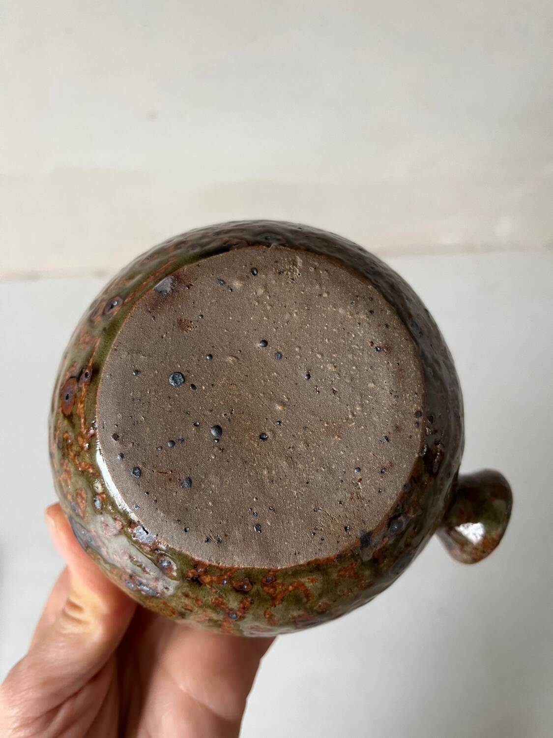 Old pyrite stoneware fondue pot