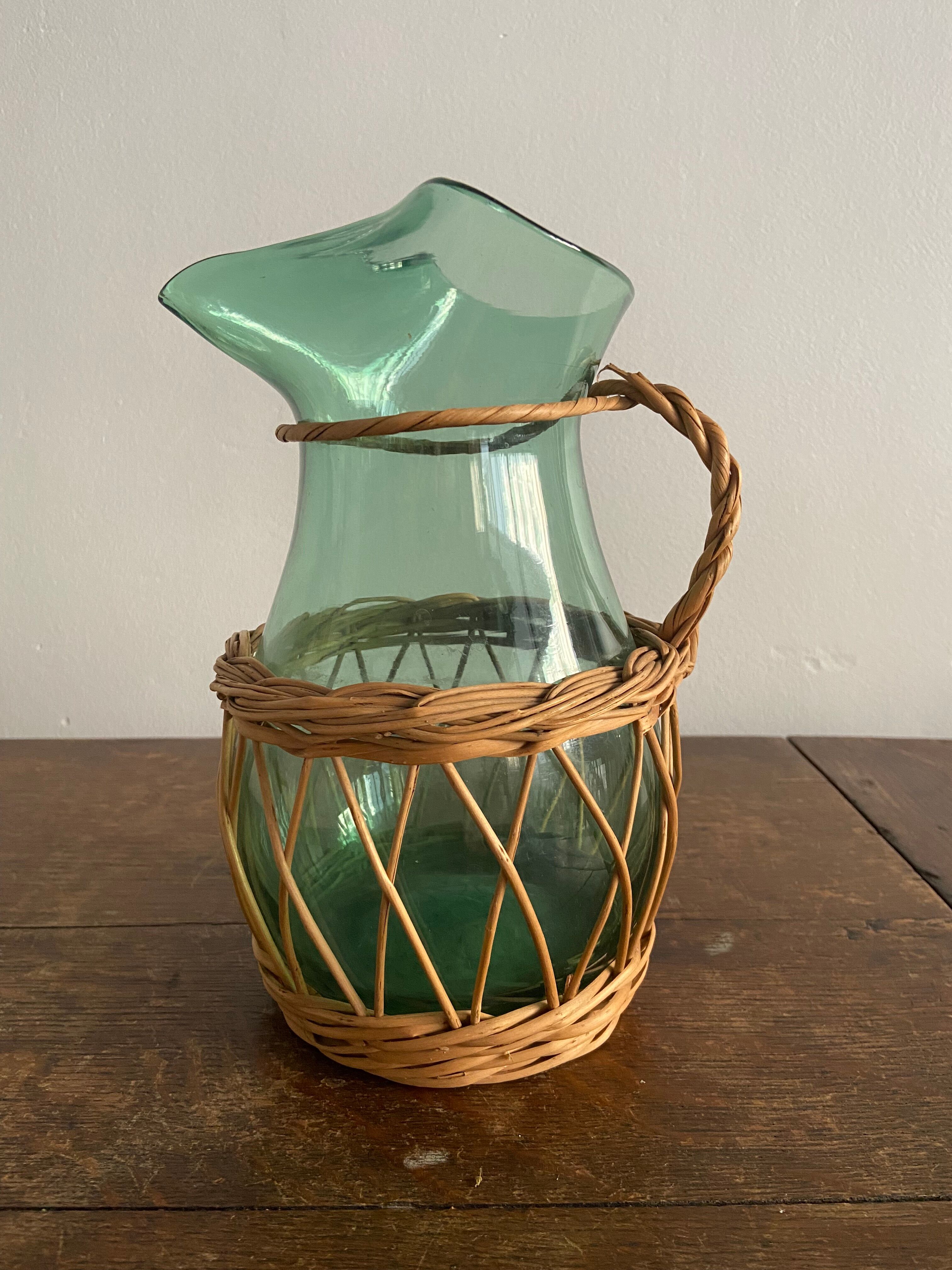 Glass pitcher and wicker