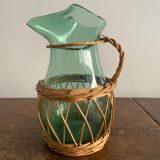 Glass pitcher and wicker