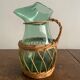 Glass pitcher and wicker