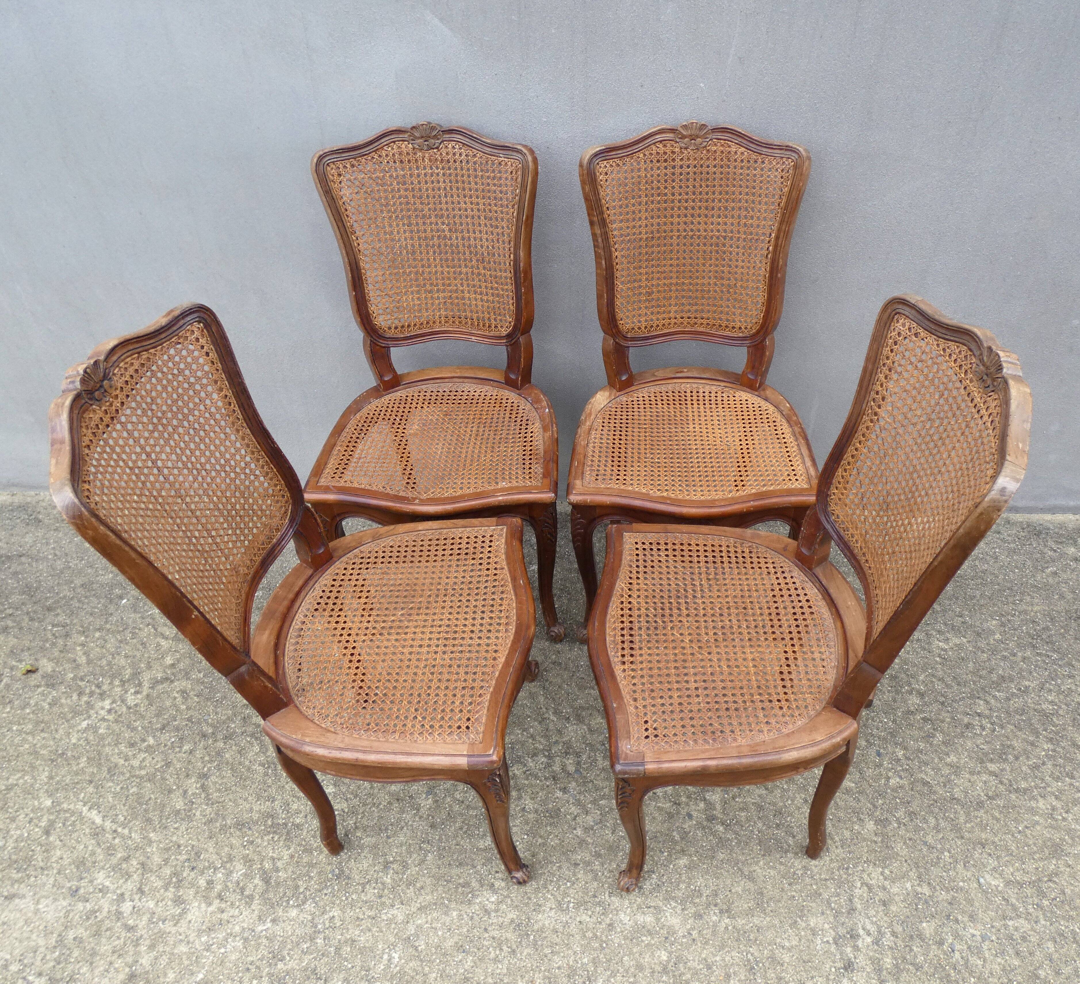4 caned wooden chairs