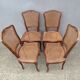 4 caned wooden chairs