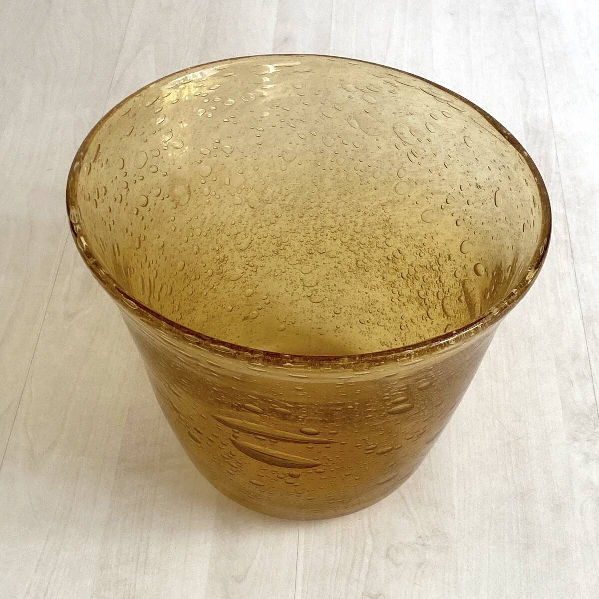 Champagne bucket from the Biot glassworks in ochre-colored blown glass