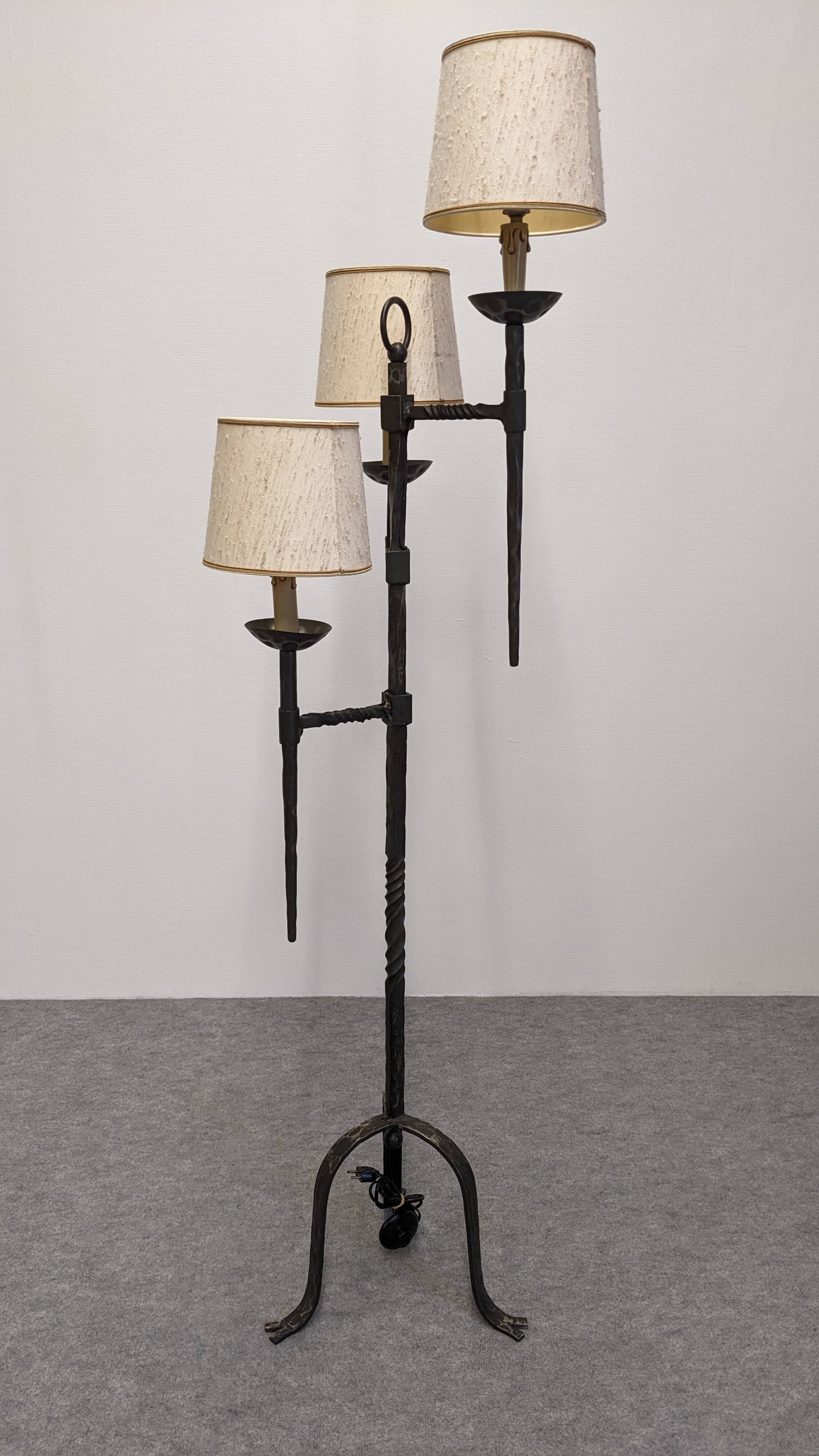 Brutalist tripod floor lamp with 3 lights in wrought iron, France circa 1950.