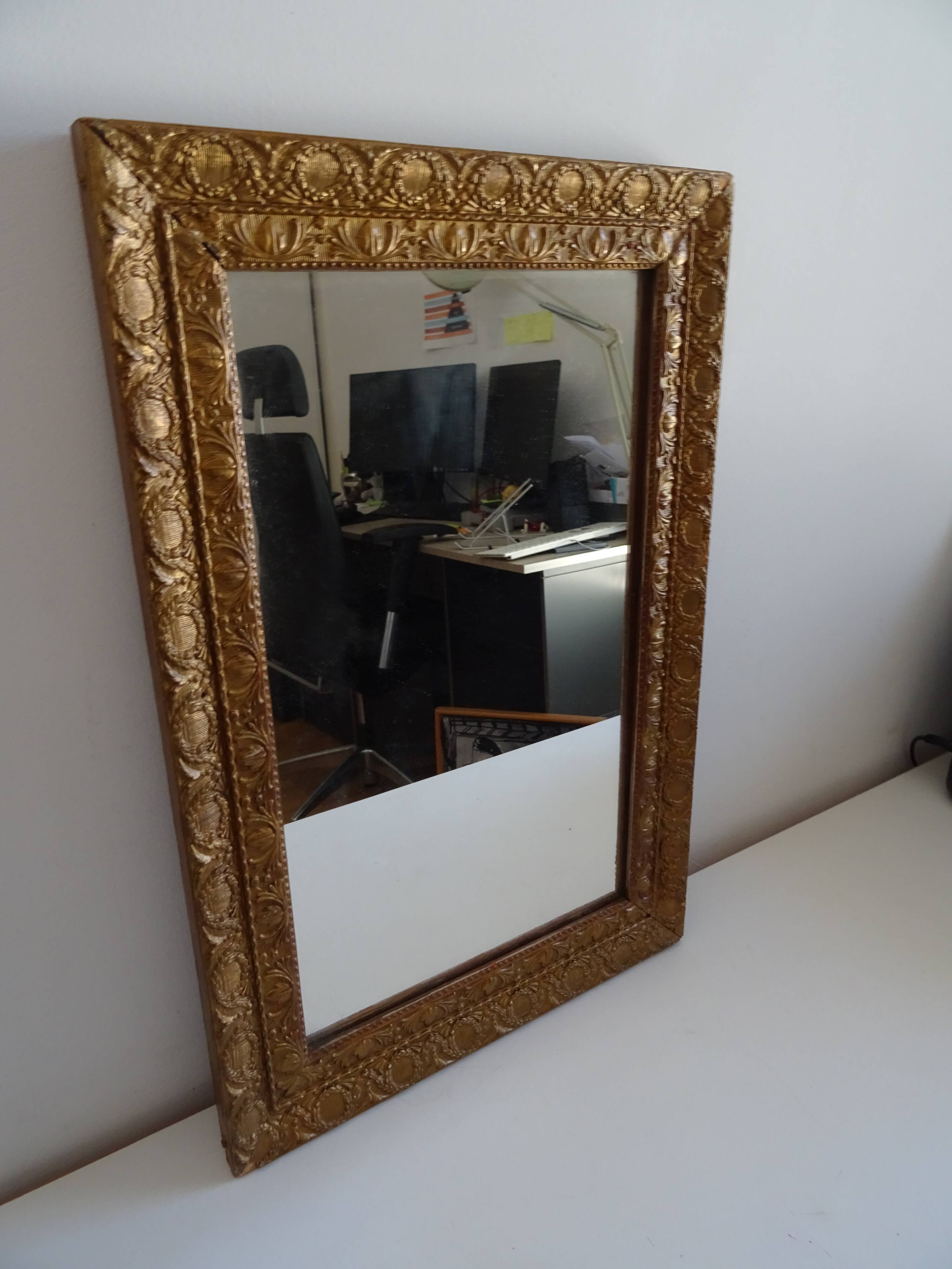 Wood and gilded stucco wall mirror