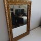 Wood and gilded stucco wall mirror