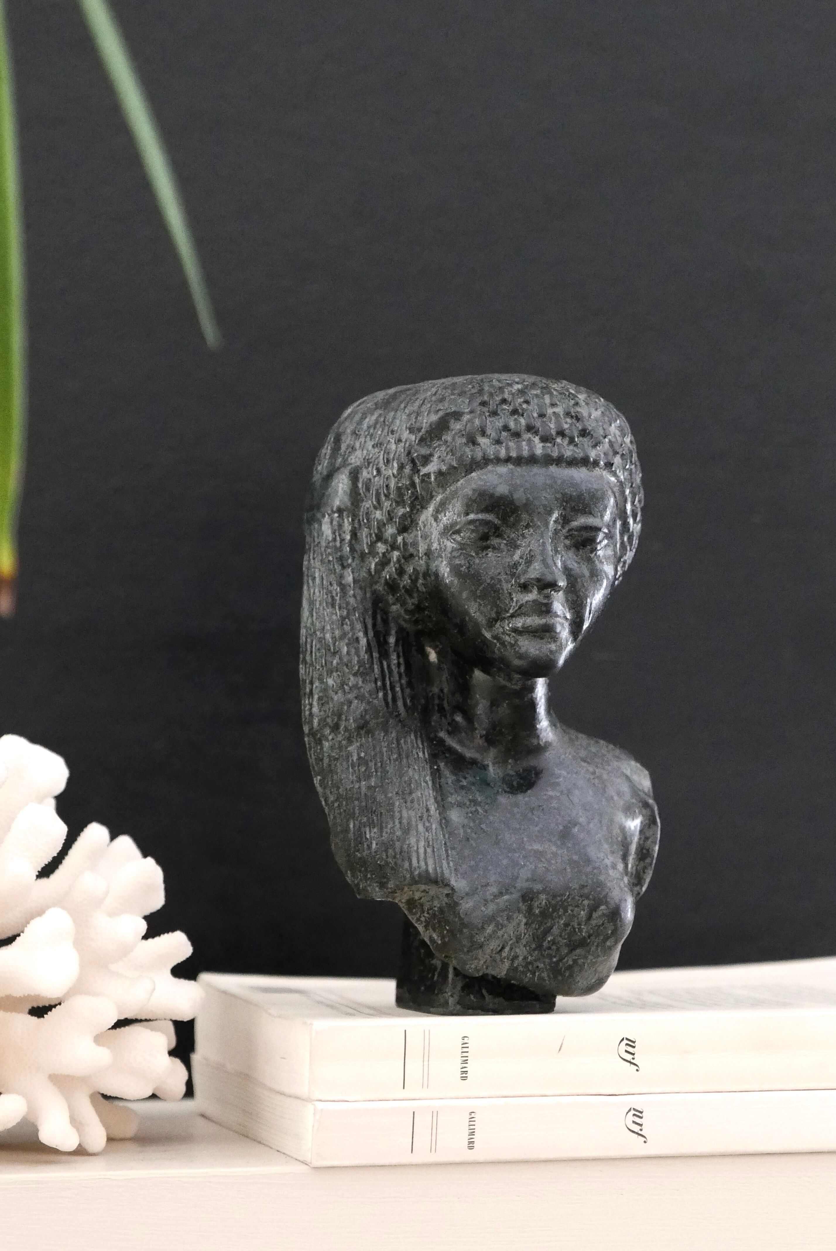 Woman bust in carved stone, 50s