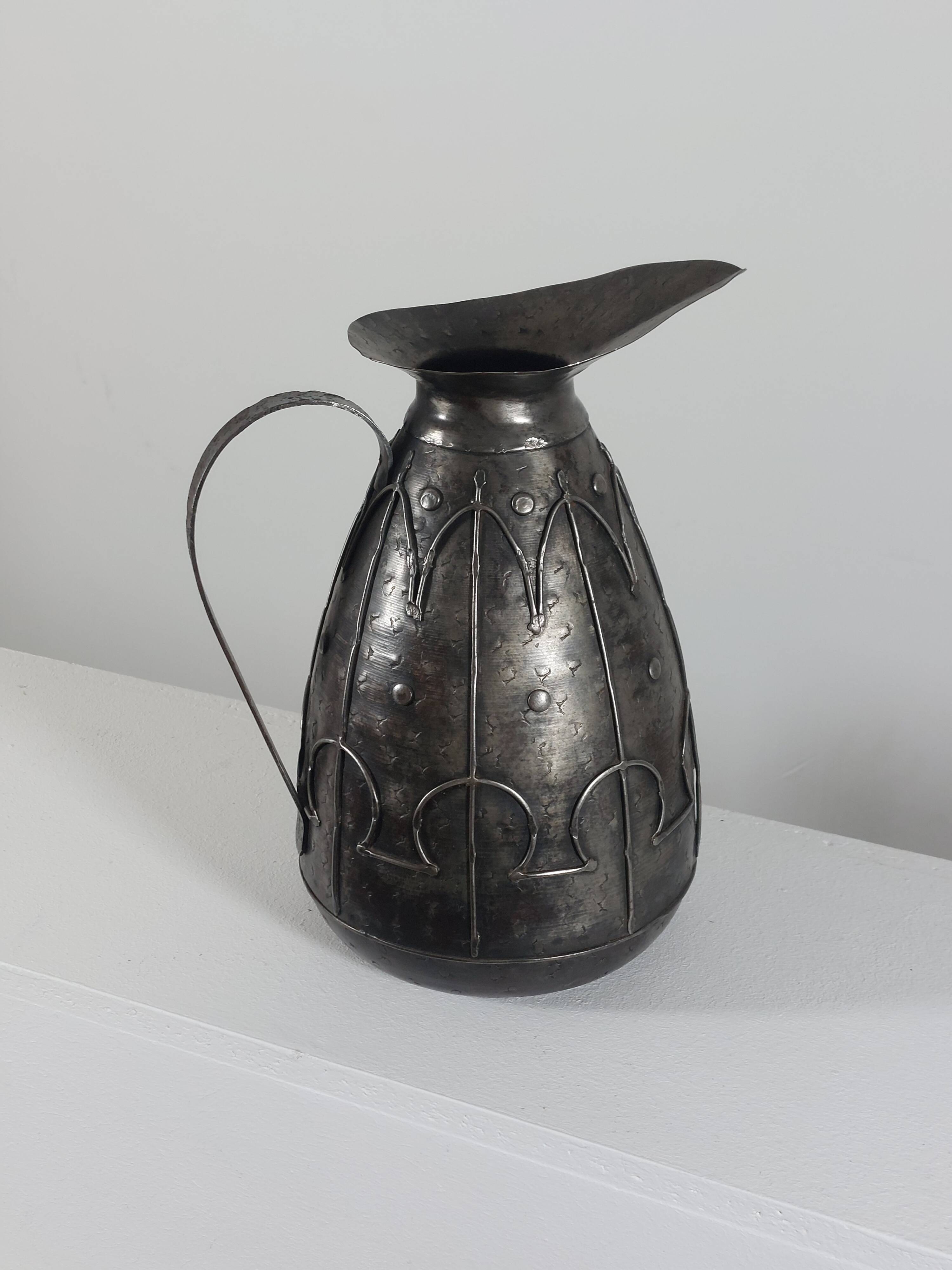 Rare hand-forged metal pitcher and craftsmanship from France.