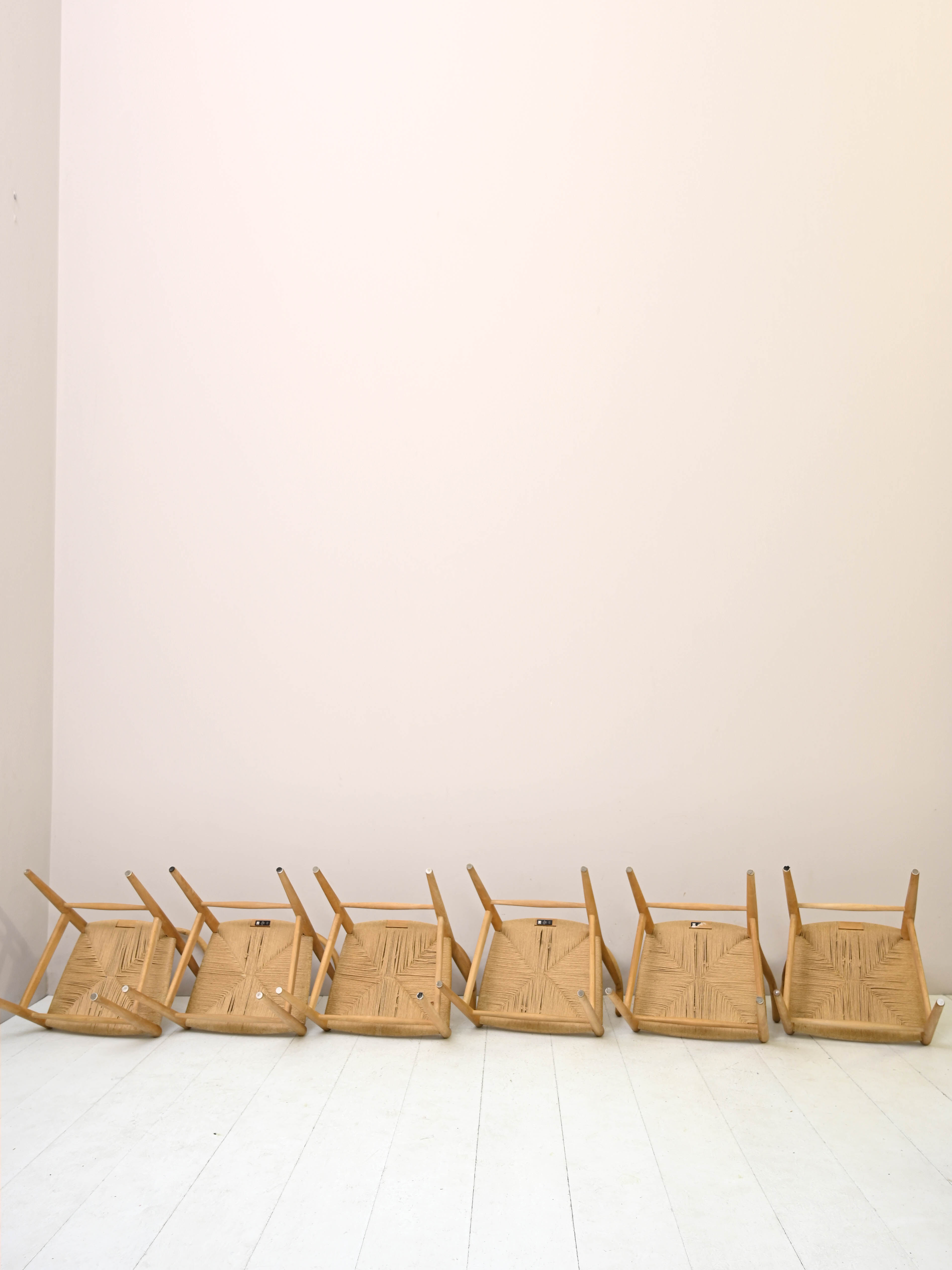 Set of six 'Wishbone chair' model chairs by Hans J. Wegner with leather cushions