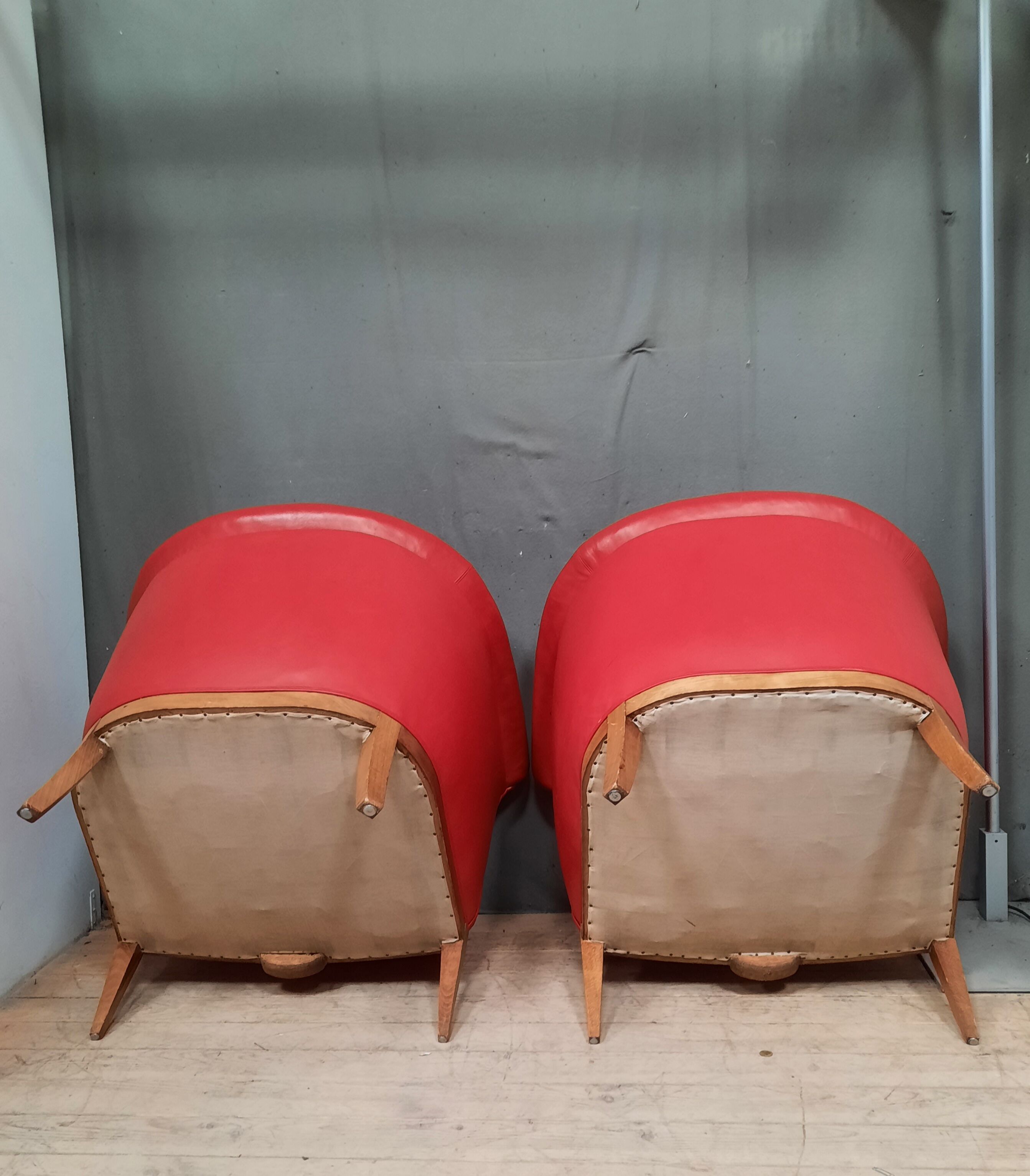Pair of red leather armchairs
