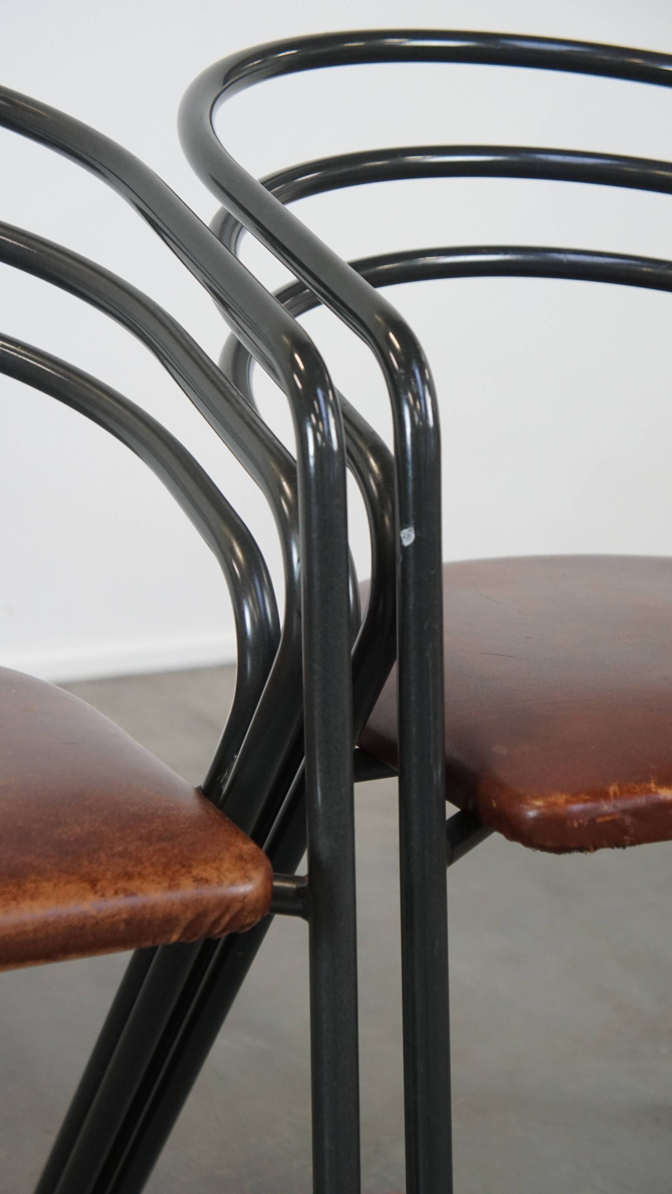 Set of 4 1970s design dining chairs with leather seats and metal frame