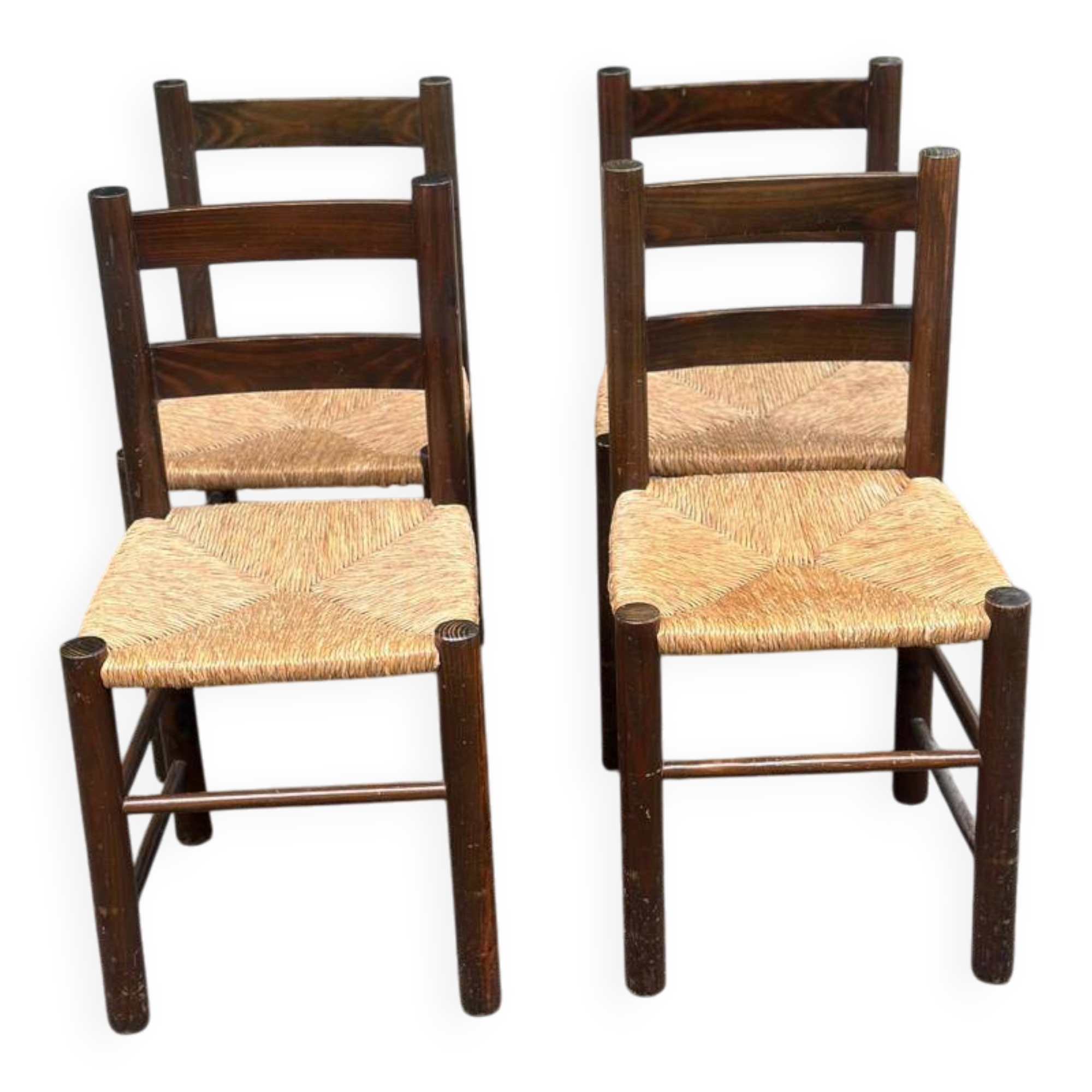 4 solid oak chairs in dark colour with elephant upholstery.