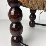 Brutalist wood turned bobbin low rush chair n the style of Charles Dudouyt