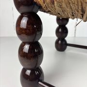 Brutalist wood turned bobbin low rush chair n the style of Charles Dudouyt