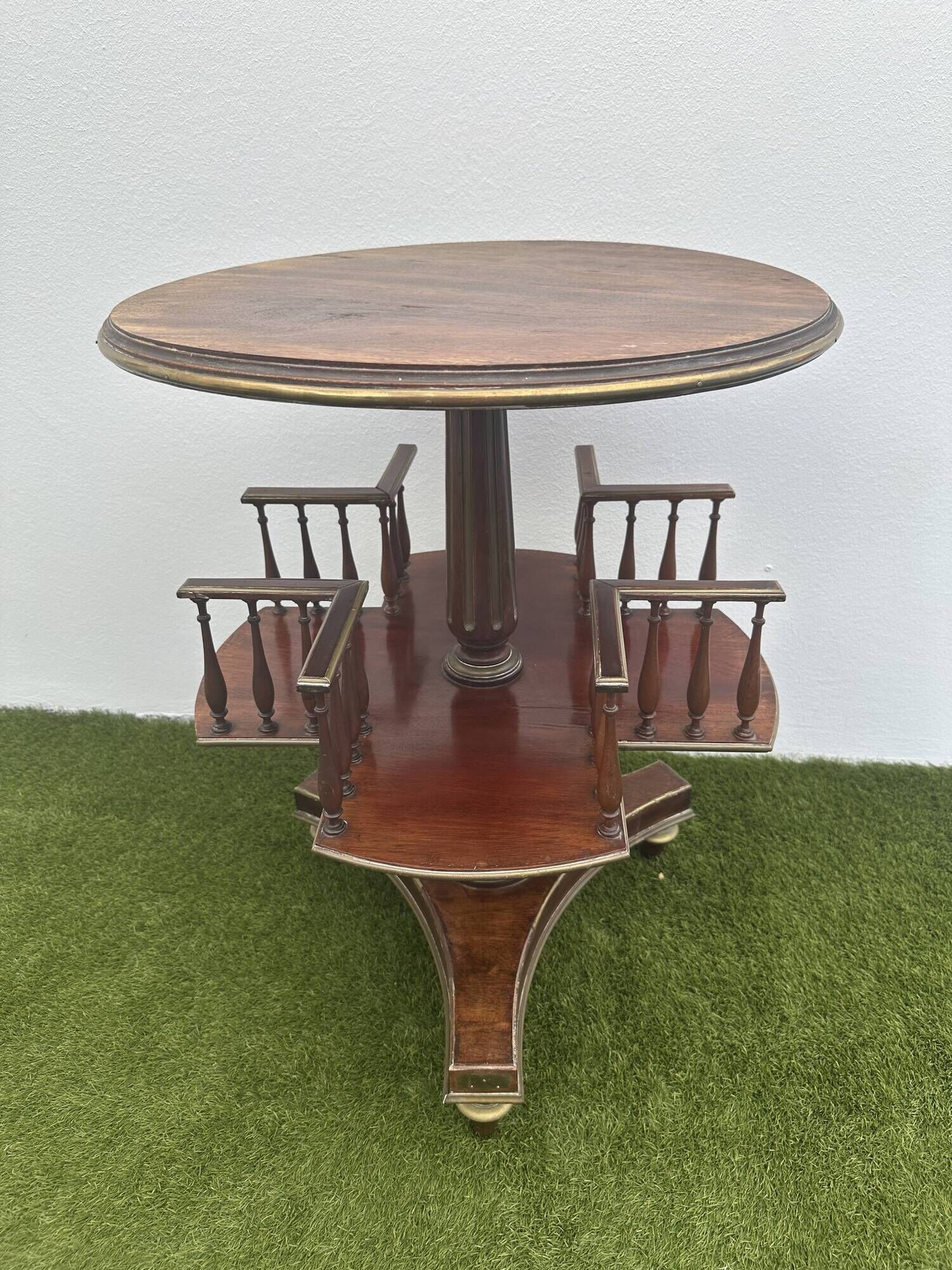 Old round and revolving wooden and brass library