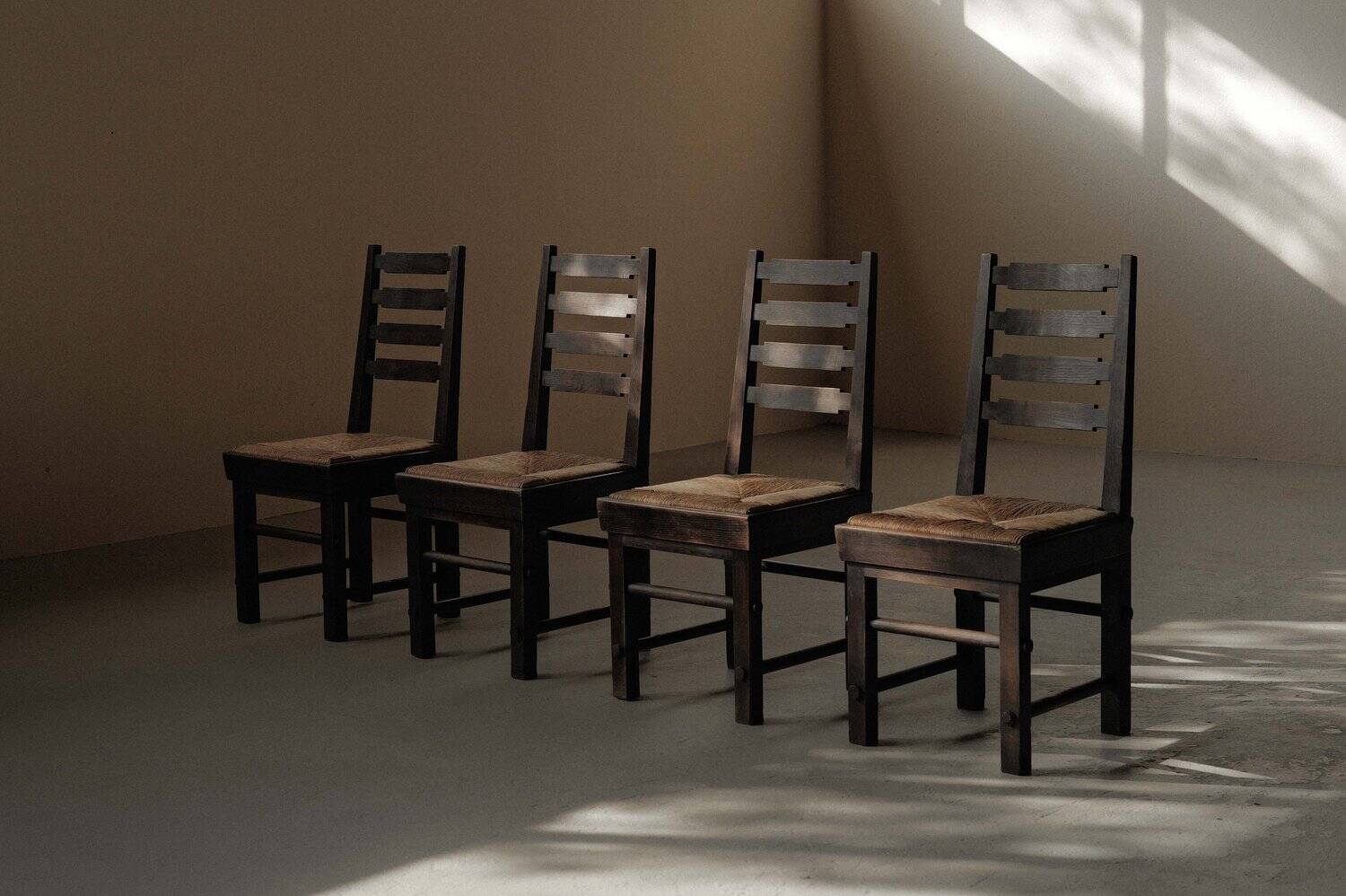 Modernist chairs in oak and woven straw, France, circa 1948