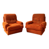 Pair of vintage 1970s armchairs in orange corduroy.