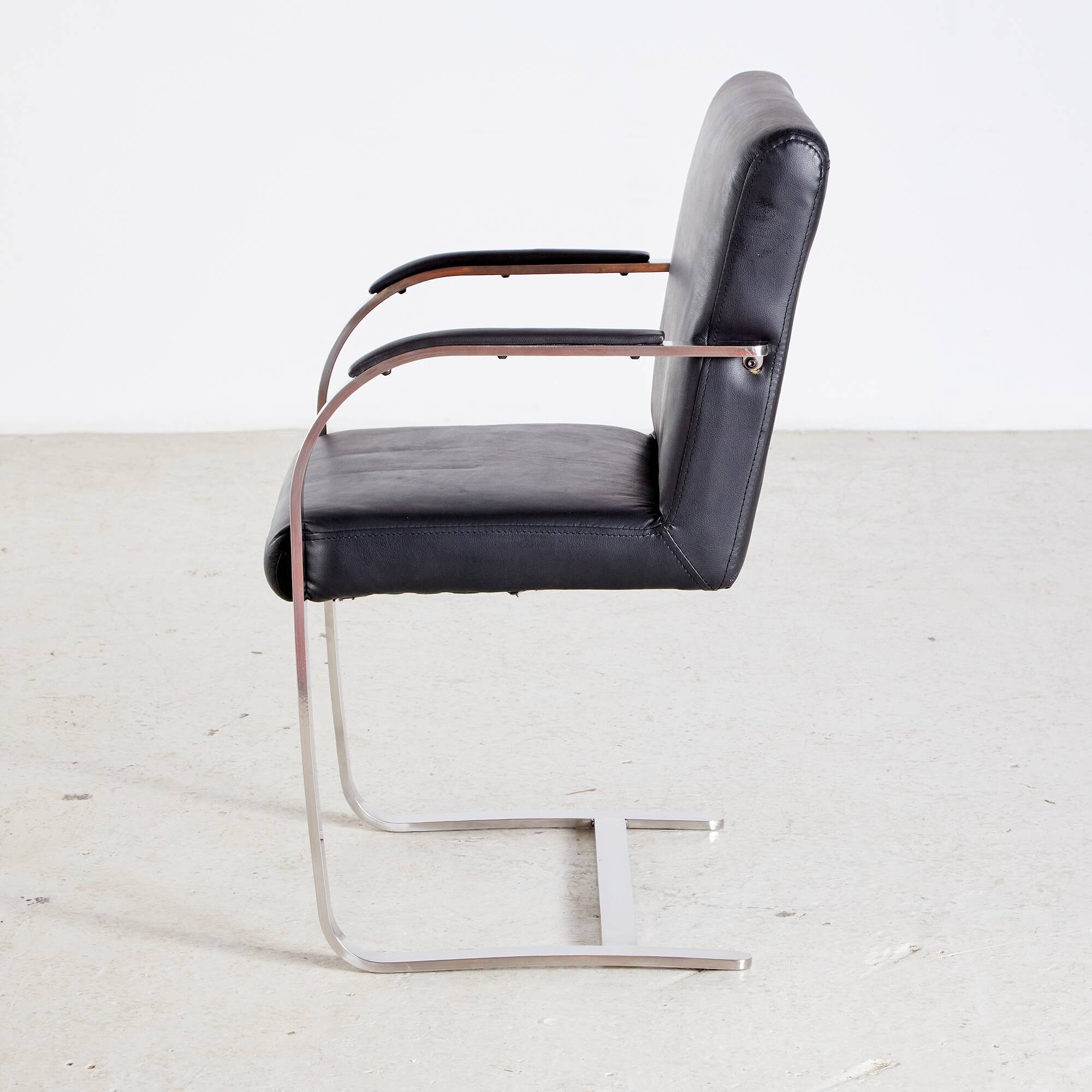 Steel armchair with leather upholstery