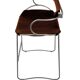 Bar stool with a backrest in aged silver metal and cognac leather, organic design.