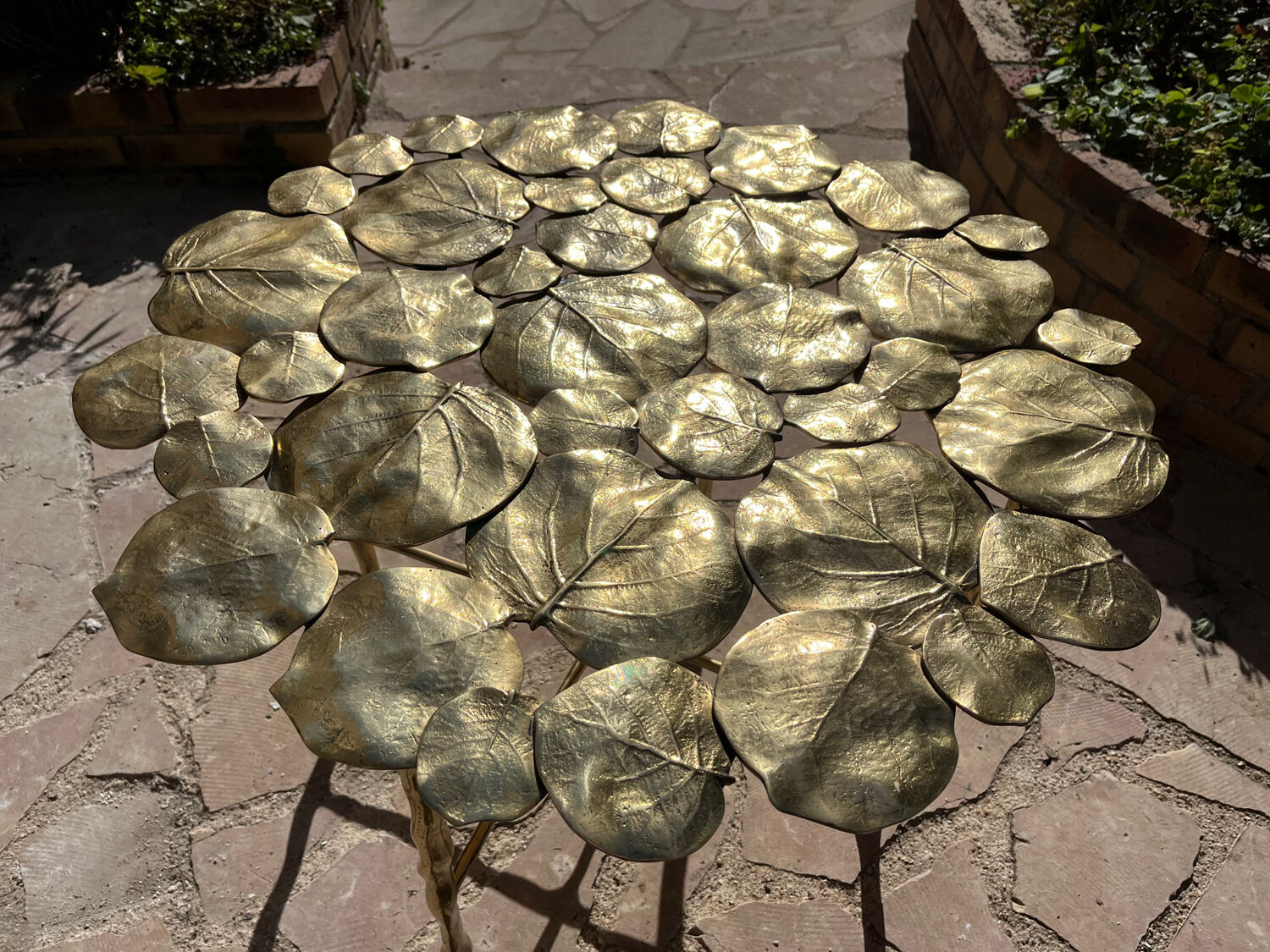 Carved brass coffee table with ginkgo decor