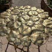 Carved brass coffee table with ginkgo decor