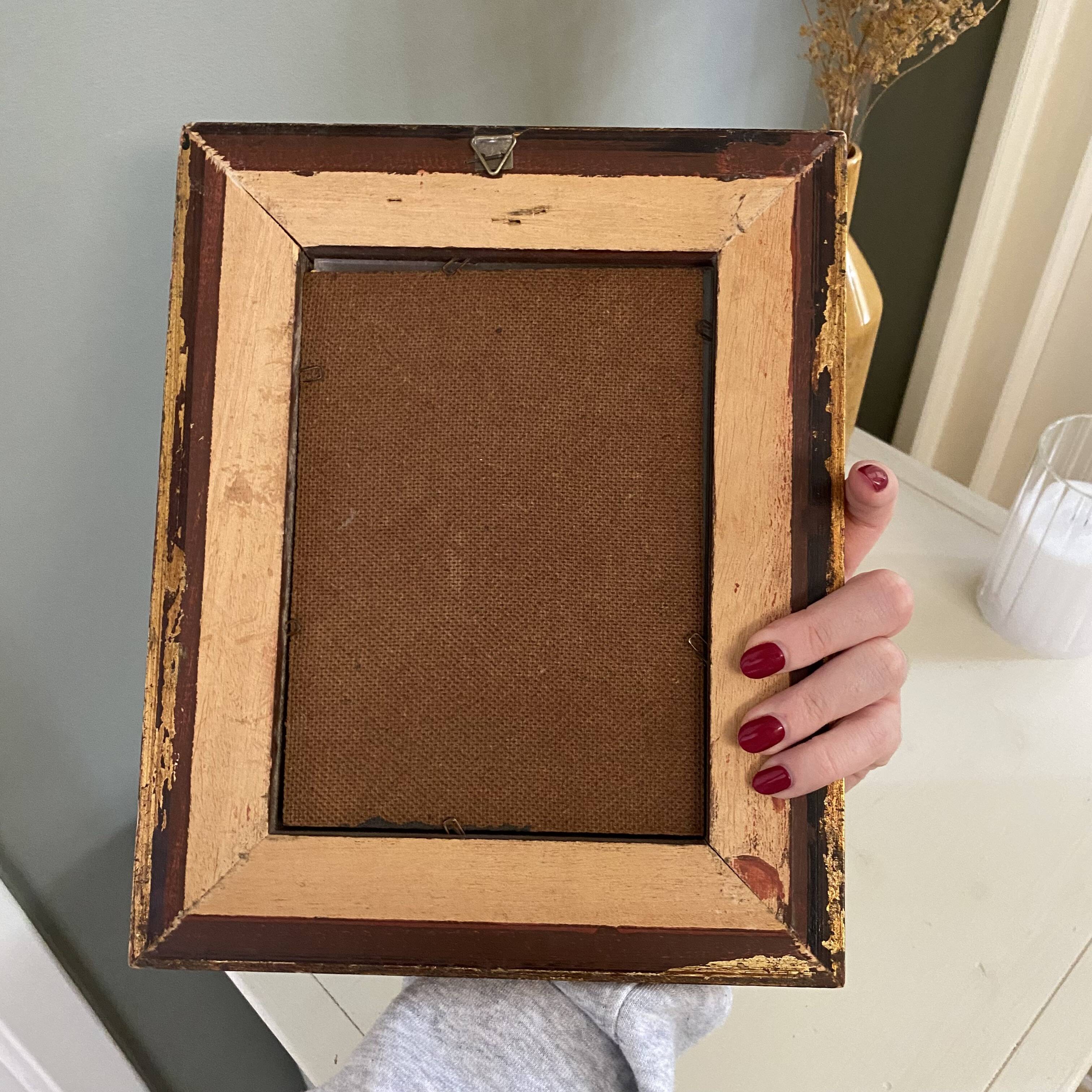 Golden frame with painting bouquet of flowers