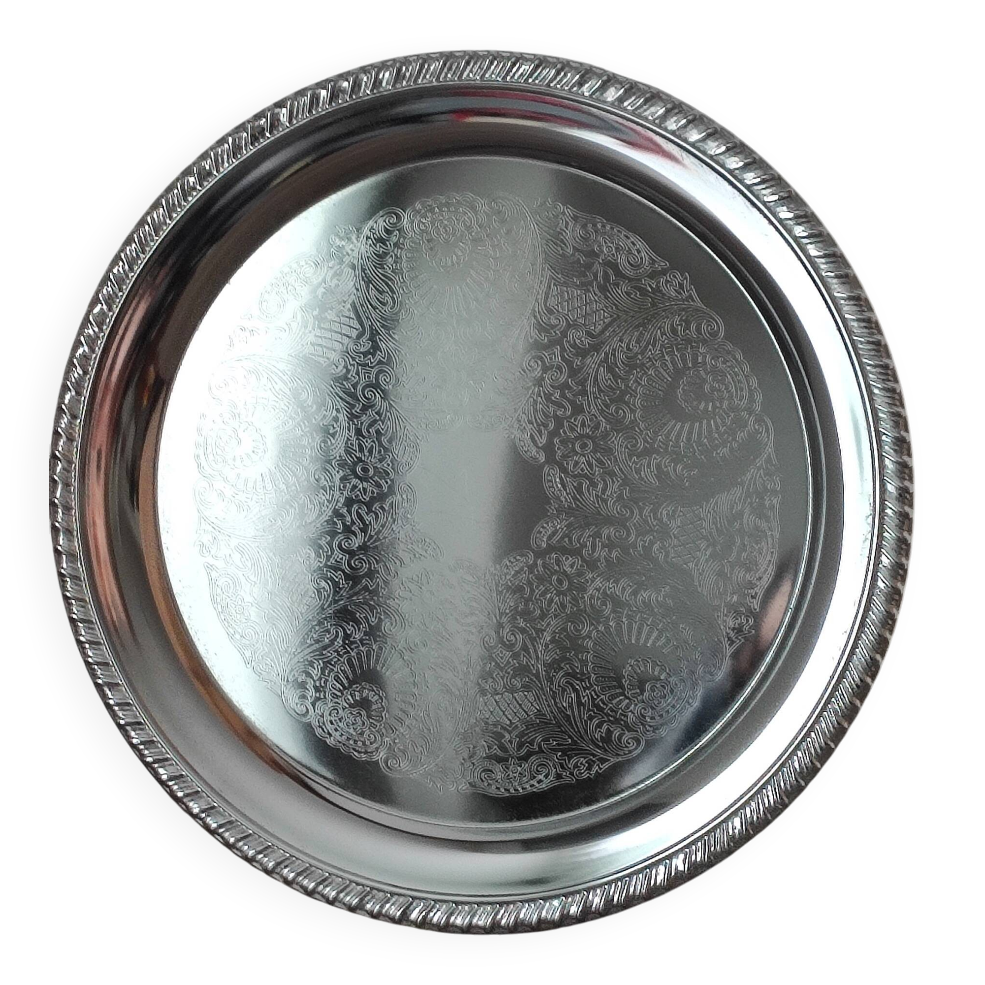 Silver-plated metal dish with a 1980s pattern.