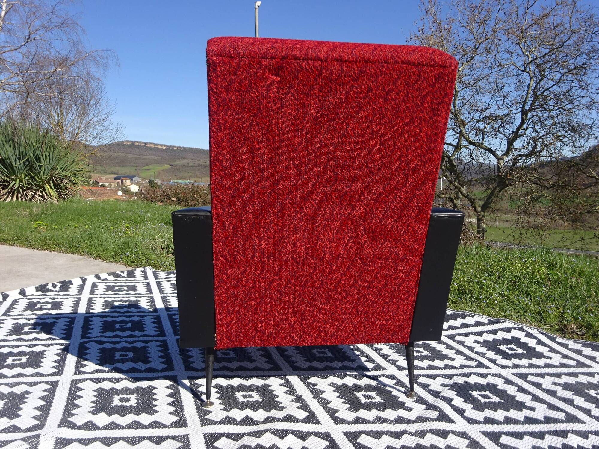 Vintage pair of red and black armchairs