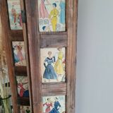 Wooden screen with vintage haute couture images or for photos