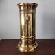 Vintage brass umbrella stand with lion decoration.