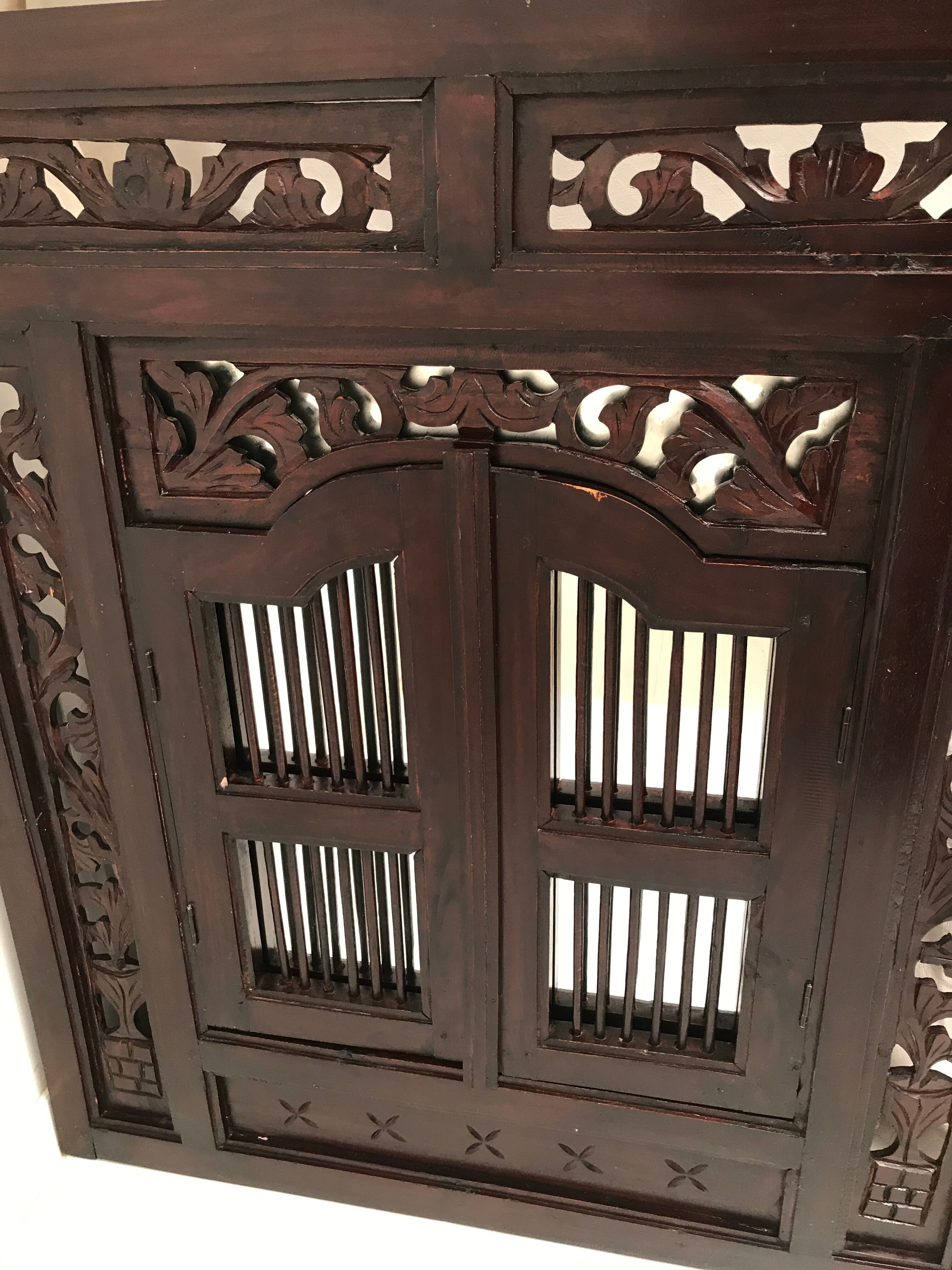 Vintage shuttered Indonesian mirror