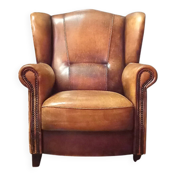 Robust vintage sheepskin armchair