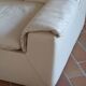 Cinna armchair in cream leather, bolstered armrests, 1970s.