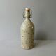 Sandstone bottle signed Guy Baudat, 70s