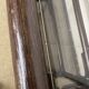 Rattan and smoked glass bookcase shelf