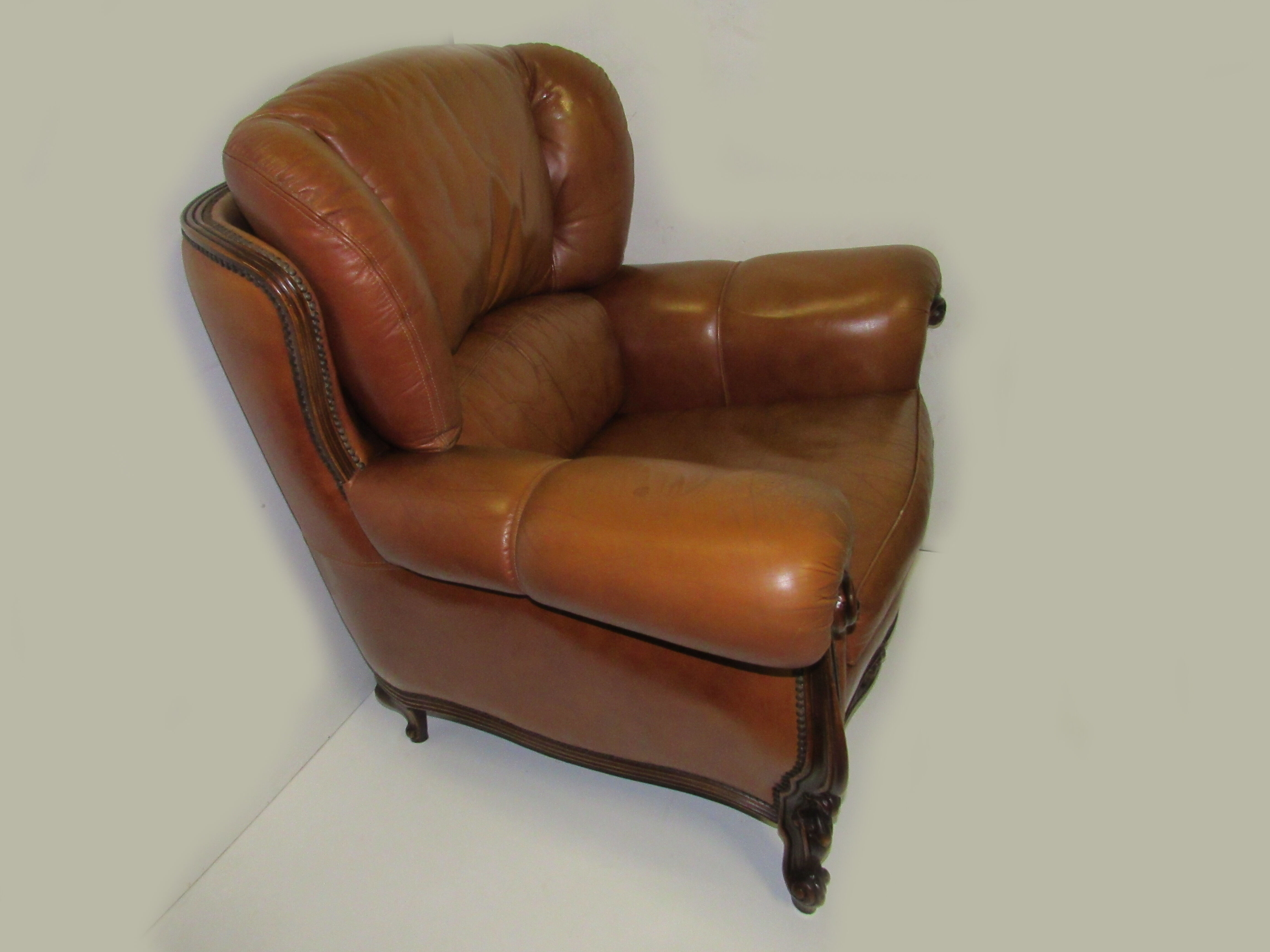 Louis XV style tawny leather chair