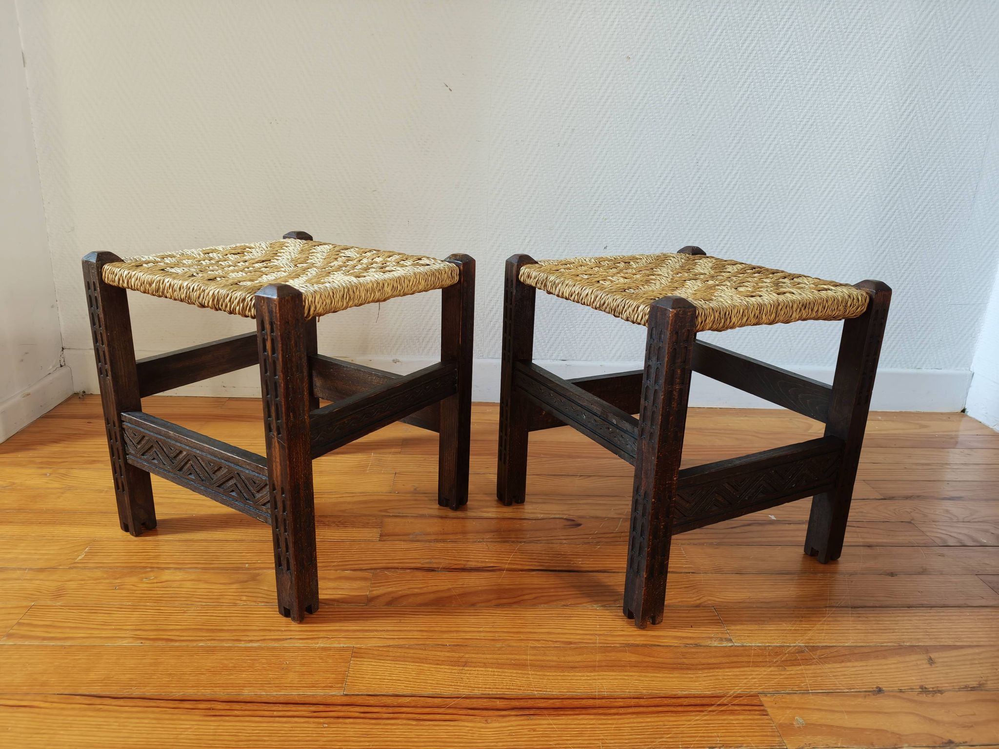 Pair of handcrafted stools from Friuli in carved wood, Italy, circa 1960.