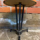 Vintage bistro table with black cast iron base and orange bakelite top, 1950s