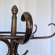 Vintage bentwood coat rack in Thonet style / Dark wood coat rack with shadow.