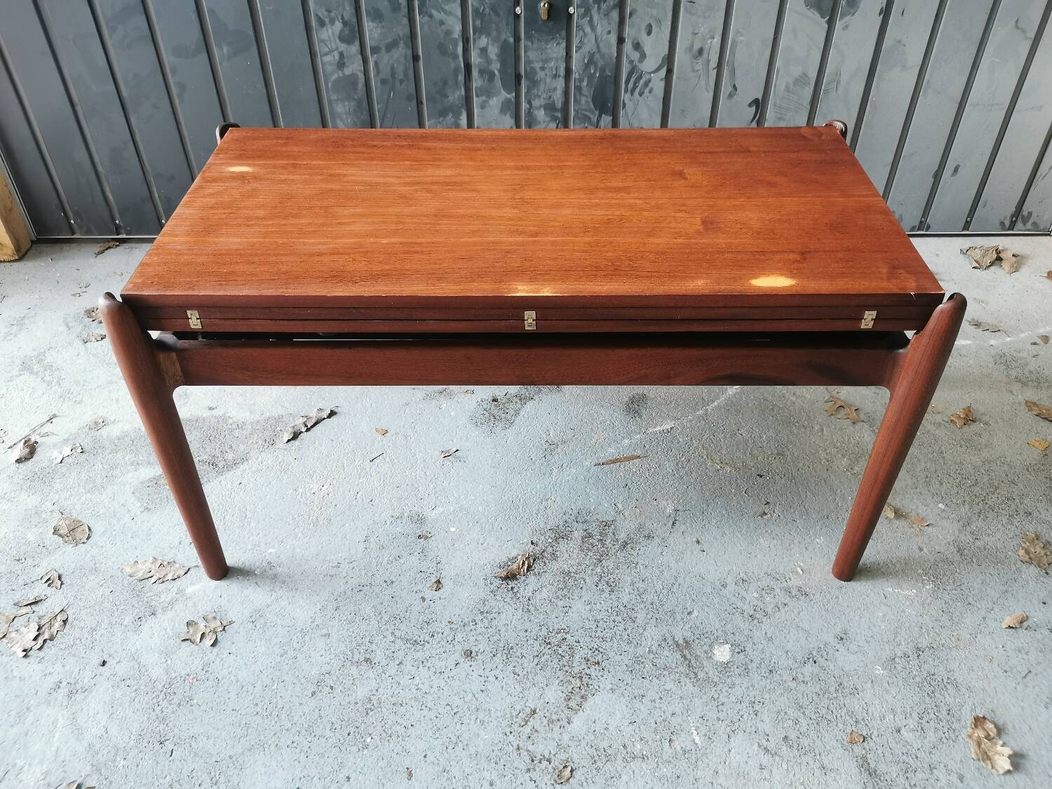 Vintage coffee table with Scandinavian rise and fall system in teak