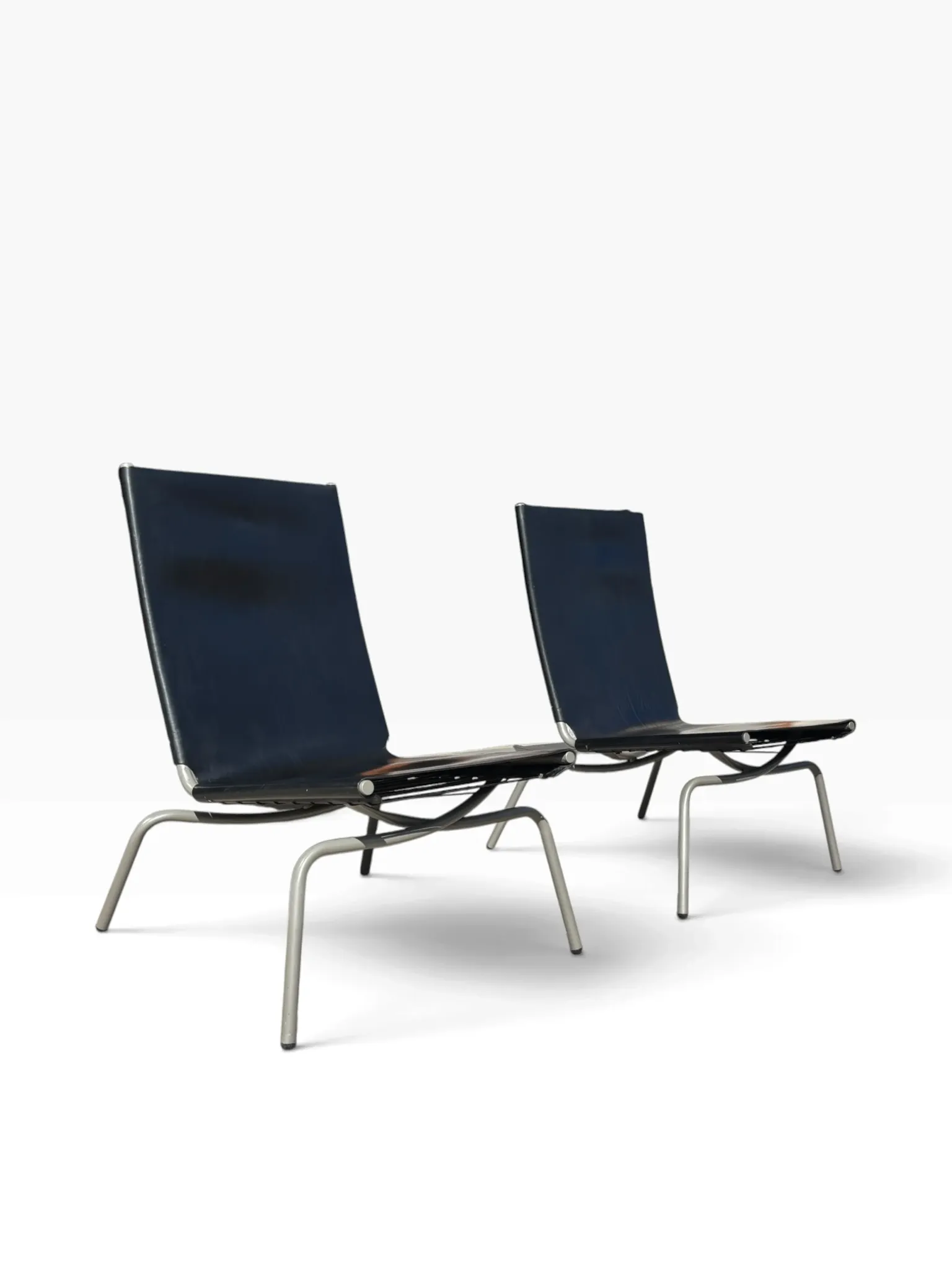 Set of 2 Crossed Legged lounge chairs by Fabiaan van Severen.