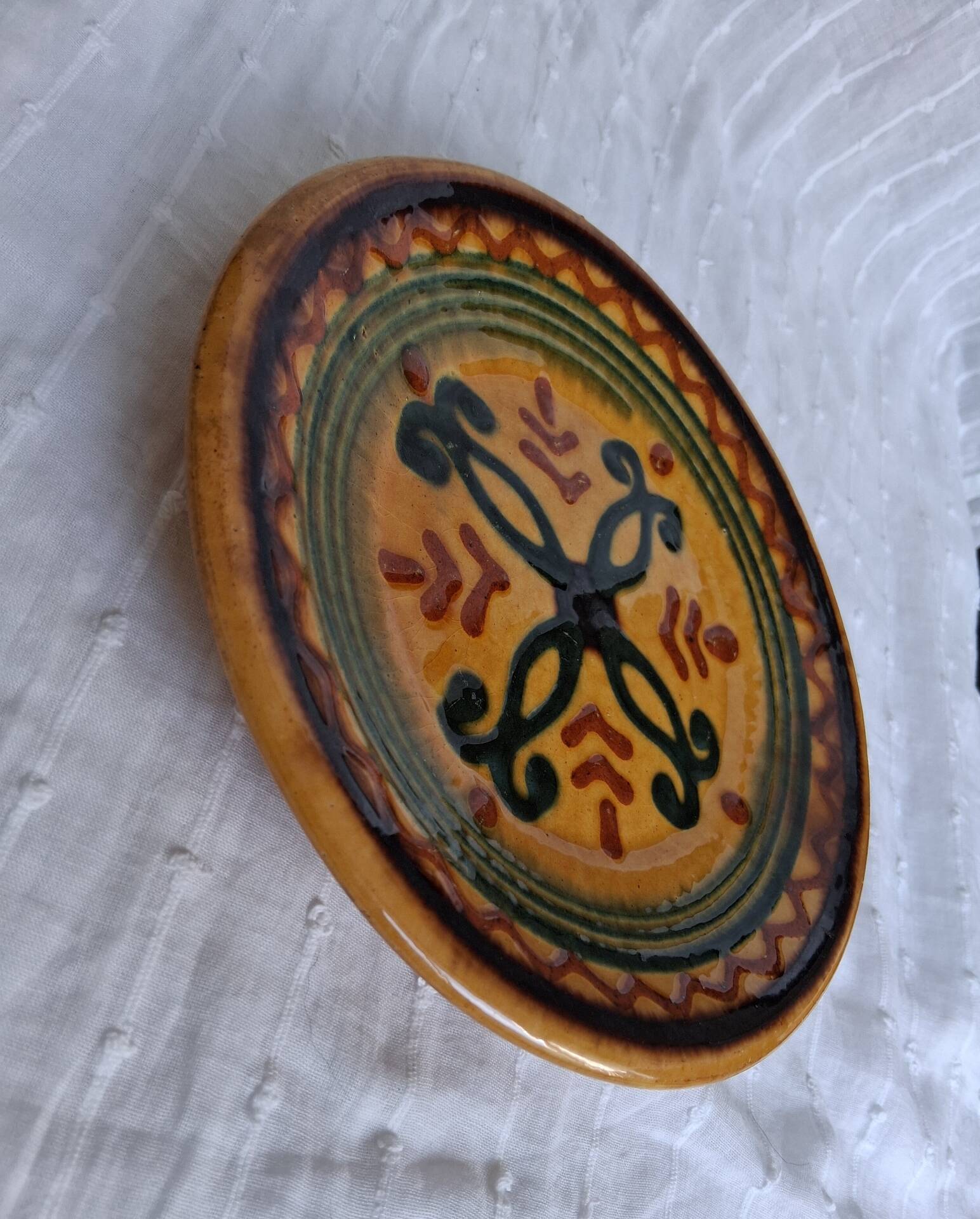 Decorative glazed earthenware plate stamped Biot, 18 cm. Vintage.