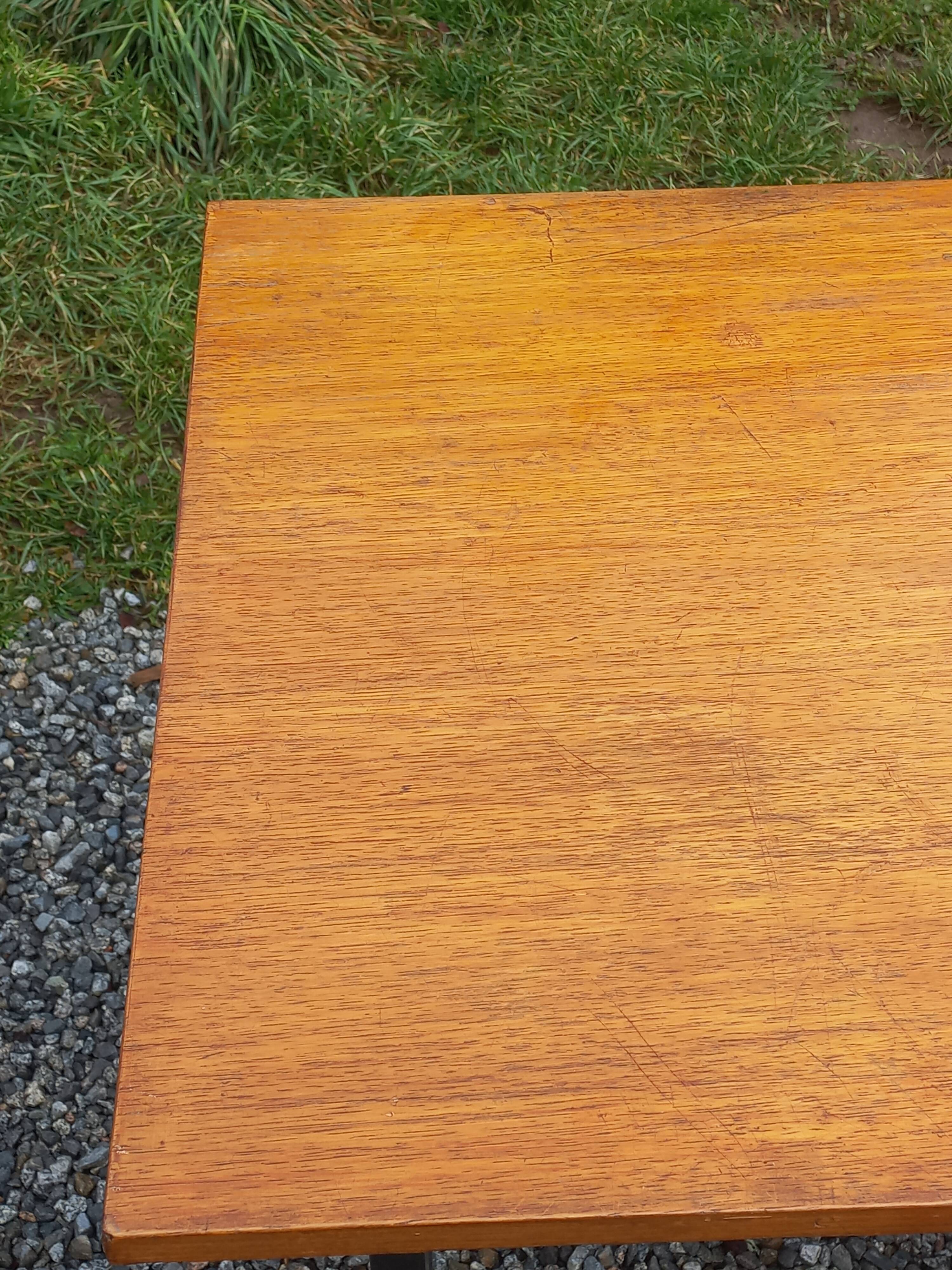 Vintage oak desk with a metallic base from the 1960s.