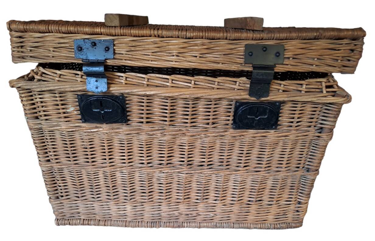 Wicker travel trunk XIX with metal clasps and handles.