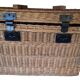 Wicker travel trunk XIX with metal clasps and handles.