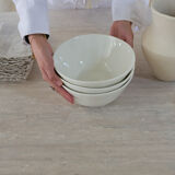 Omega circular dining table in natural travertine