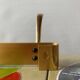 Vintage wall-mounted coat rack in golden aluminum - triple coat hook