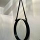 Jacques Adnet pair of circular leather and brass mirrors