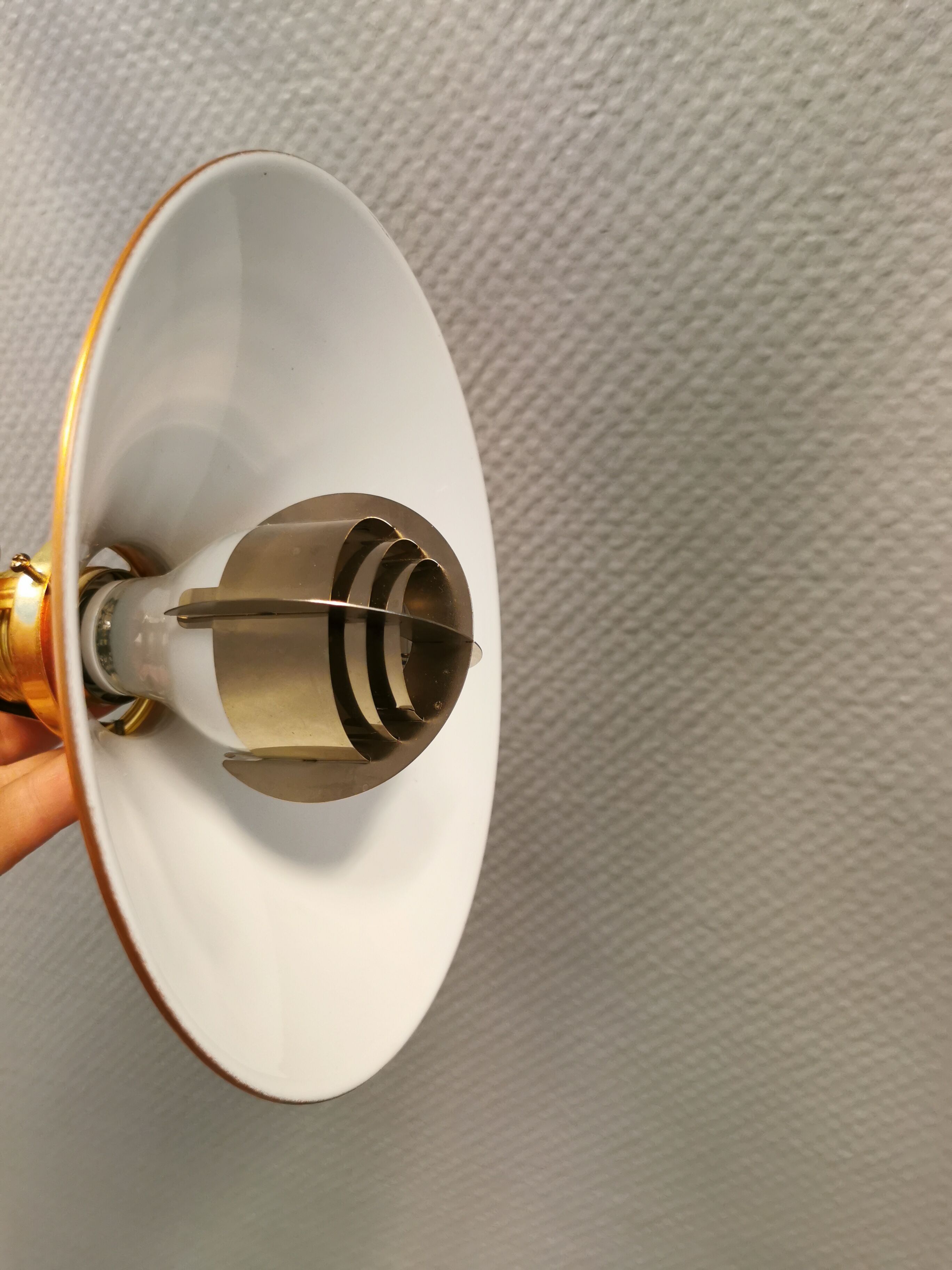 Copper hanging lamp with brass colored top and white inside lacquer.