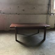 Mid-century coffee table in brown wood from the 1970s, rectangular top with rounded corners.